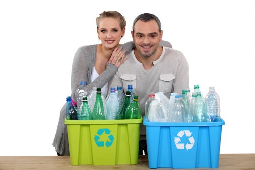 Recycling percentage target chart and sorting bins in a commercial area